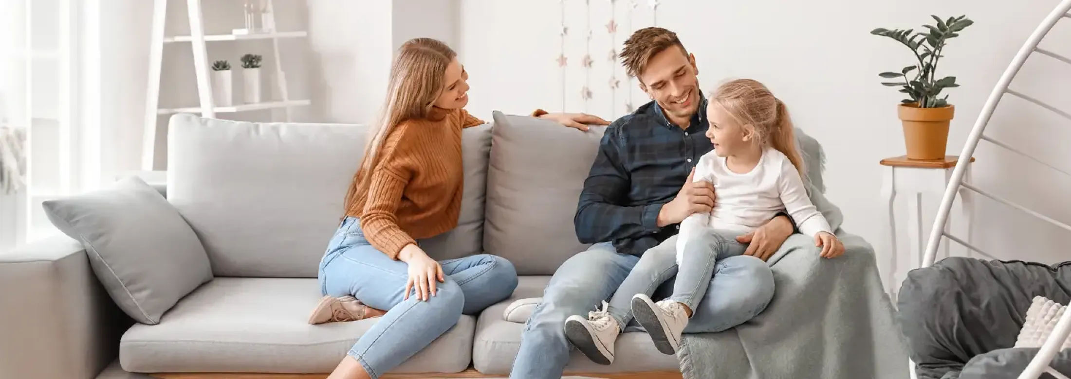 family sitting on couch